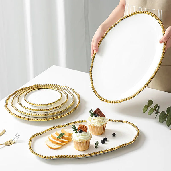 European-style porcelain dinner plate with bead-dot rim detail