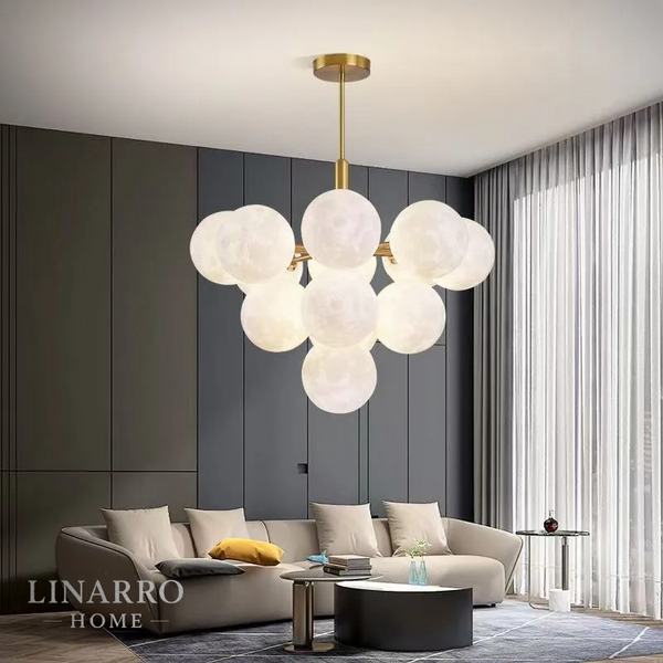 "Modern PVC LED chandelier with 13 lights in a gold finish, illuminating a contemporary dining room."